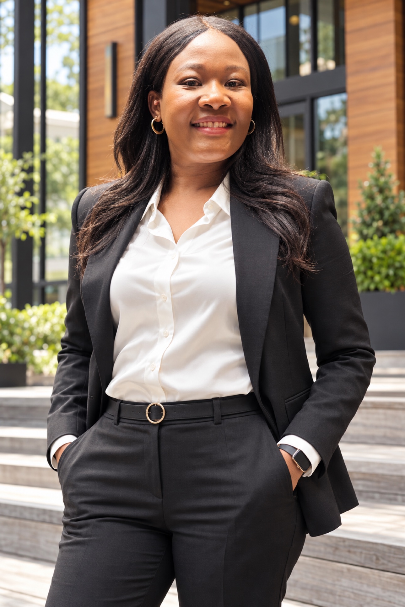 Caroline Oloo in professional attire outdoors